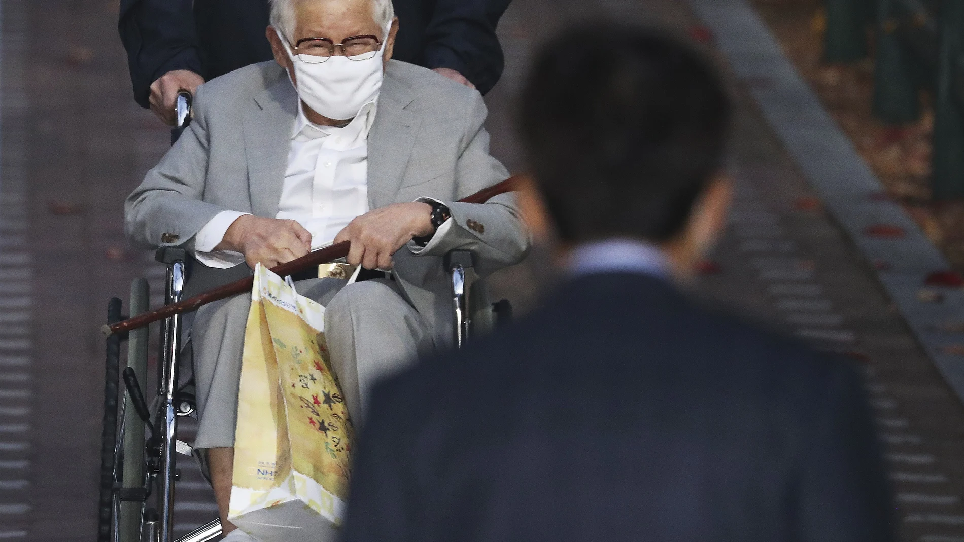 Lee Man-hee, a leader of Shincheonji Church of Jesus, leaves a detention center in Suwon, South Korea, Thursday, Nov. 12, 2020. Lee on Thursday was granted bail by the Suwon District Court, which cited concerns over his health. The court required Lee to wear electronic tracking devices and not to leave his home. (Hong Ki-won/Yonhap via AP)