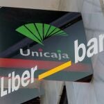 Doble exposición de los logotipos de las entidades Unicaja y Liberbank
