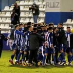 Los jugadores del Alcoyano celebran su pase a los octavos de la Copa del Rey tras derrotar por 2-1 al Real Madrid
