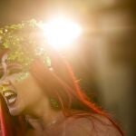 A woman performs in the "Desliga da Justica" block party in Rio de Janeiro, Brazil, Sunday, Feb. 14, 2021. The party was broadcast live on social media for those who were unable to participate in the carnival due to COVID restrictions after the city's government officially suspended Carnival and banned street parades or clandestine parties. (AP Photo/Bruna Prado)