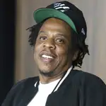 FILE - In this July 23, 2019, file photo, Jay-Z makes an announcement of the launch of Dream Chasers record label in joint venture with Roc Nation, at the Roc Nation headquarters in New York. Moet Hennessy is acquiring a 50% stake in the rapper and entrepreneur's Champagne brand, Armand de Brignac, in an effort to up its cool factor and expand sales. Jay-Z, whose real name is Shawn Carter, said the partnership will help Armand de Brignac grow and flourish.  (Photo by Greg Allen/Invision/AP, File)