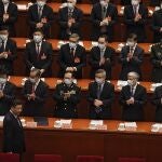 FILE - In this March 4, 2021, file photo, delegates wearing face masks to help curb the spread of the coronavirus applaud as Chinese President Xi Jinping arrives for the opening session of Chinese People's Political Consultative Conference (CPPCC) at the Great Hall of the People in Beijing. The catchword â€œrejuvenationâ€ has been tucked into the major speeches at China's biggest political event of the year, the meeting of its 3,000-member legislature. (AP Photo/Andy Wong, File)