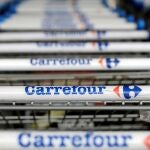 FILE PHOTO: The logo of French retailer Carrefour on shopping trolleys . REUTERS/Paulo Whitaker/File Photo
