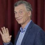 FILE - In this Oct. 27, 2019 file photo, President Mauricio Macri waves as he arrives to a polling station in Buenos Aires, Argentina. Macri is expected to present his book titled "Primer Tiempo", on Thursday, March 18, 2021, in which he reveals details of his 2015-2019 government. (AP Photo/Daniel Jayo, File)