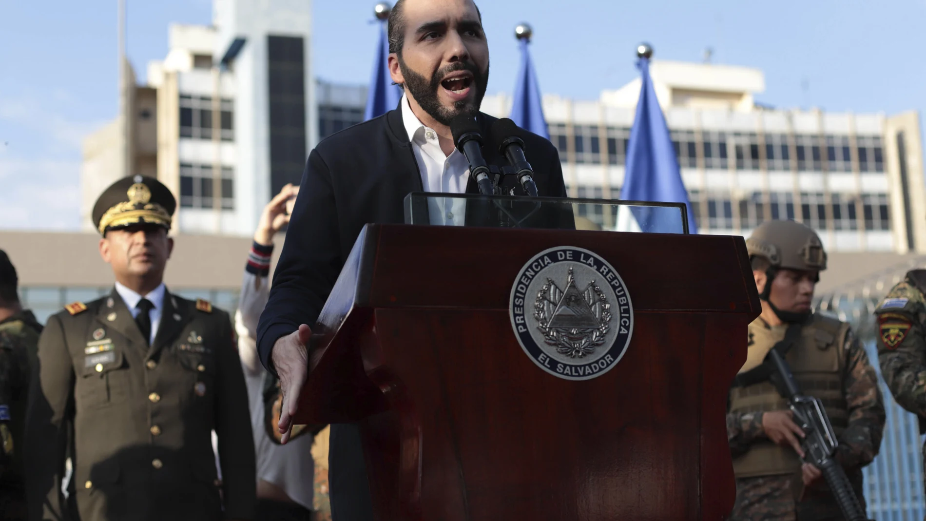 FILE - In this Feb. 9, 2020 file photo, El Salvador's President Nayib Bukele, accompanied by members of the armed forces, speaks to his supporters outside Congress in San Salvador, El Salvador. Bukele's party has swept all three main opposition parties during 2021's midterm elections, giving him a mandate to change the way politics are run in the central American country. (AP Photo/Salvador Melendez, File)