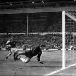 FILE - In this July 30, 1966 file photo, a shot from Geoff Hurst bounces down from the West Germany crossbar during the World Cup final at London's Wembley Stadium. The linesman gave it as a goal and England went to to win 4-2. England won its only World Cup title by beating West Germany in London in a match that produced an enduring moment of controversy that is still the subject of debate. In extra time with the scored even at 2-2, Alan Ball crossed to England teammate Geoff Hurst, who turned and shot. The ball thumped down from the underside of the West German crossbar and Roger Hunt raised his arms to proclaim the ball bounced over the goal line. (AP Photo/File)