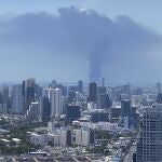 In a view from downtown Bangkok, giant plumes of smoke can be seen rising from the Samut Prakan province, Thailand, Monday, July 5, 2021. A massive explosion at a factory on the outskirts of Bangkok has shaken an airport terminal serving Thailandâ€™s capital, damaged homes in the surrounding neighborhood, and prompted the evacuation of a wide area over fears of poisonous fumes from burning chemicals and the possibility of additional denotations. (Tina Liu via AP)