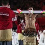 Pita Taufatofua, of Tonga, walks during the opening ceremony in the Olympic Stadium at the 2020 Summer Olympics, Friday, July 23, 2021, in Tokyo, Japan. (AP Photo/Petr David Josek)