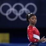 Simone Biles, of the United States, waits to perform on the vault during the artistic gymnastics women's final at the 2020 Summer Olympics, Tuesday, July 27, 2021, in Tokyo. The American gymnastics superstar has withdrawn the all-around competition to focus on her mental well-being. (AP Photo/Gregory Bull)