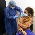 Elisa Rios gets a third dose of the Pfizer COVID-19 vaccine at the Clinicas Hospital in Montevideo, Uruguay, Monday, Aug. 16, 2021. (AP Photo/Matilde Campodonico)