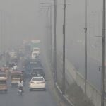 FILE - In this Wednesday, Nov. 11, 2020 file photo, vehicles drive on a highway as smog envelops the area of Lahore, Pakistan. The World Health Organization said Wednesday Sept. 22, 2021, the negative health impacts of poor air quality kick in at lower levels than it previously thought, announcing revisions to its guidelines on air quality that set a higher bar for policymakers in a world where 90 percent of people already live in areas with one particularly harmful type of pollutant. (AP Photo/K.M. Chaudary, File)