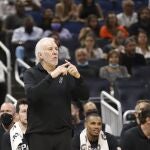 San Antonio Spurs coach Gregg Popovich calls in a play to his team during the second half of an NBA basketball game against the Orlando Magic, Sunday, Oct. 10, 2021, in Orlando, Fla. (AP Photo/Jacob M. Langston)