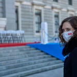 La presidenta de la Comunidad de Madrid, Isabel Díaz Ayuso, a su llegada a la eucaristía con motivo del Día de la Virgen de la Almudena, patrona de Madrid