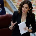 La presidenta de la Comunidad de Madrid, Isabel Díaz Ayuso, durante su intervención en el pleno de la Asamblea