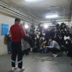 Senior editor of Stand News Ronson Chan, is surrounded by journalists outside his office after released from police station in Hong Kong, Wednesday, Dec. 29, 2021. Hong Kong police raided the office of the online news outlet on Wednesday after arresting several people for conspiracy to publish a seditious publication. (AP Photo/Vincent Yu)