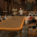 Fotografía cedida por Optima Classical Academy a EFE que muestra una de sus clases de realidad virtual 3D donde aparece un profesor mientras imparte su clase a unos alumnos en la Biblioteca de Oxford.
