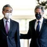 U.S. Secretary of State Antony Blinken, right, and China's Foreign Minister Wang Yi talk before a meeting in Nusa Dua on the Indonesian resort island of Bali, Saturday, July 9, 2022. (Stefani Reynolds/Pool Photo via AP)
