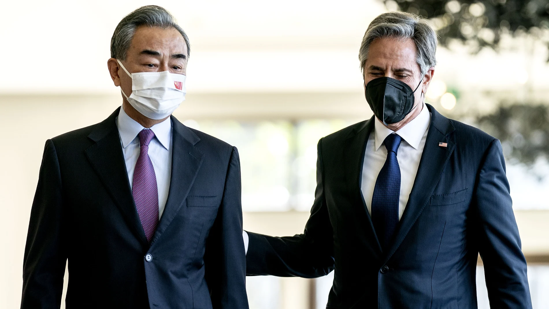 U.S. Secretary of State Antony Blinken, right, and China's Foreign Minister Wang Yi talk before a meeting in Nusa Dua on the Indonesian resort island of Bali, Saturday, July 9, 2022. (Stefani Reynolds/Pool Photo via AP)