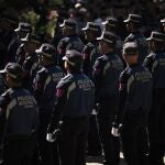 Agentes de la Policia Municipal durante el acto de conmemoracion de la festividad de San Juan Bautista, patron de la Policia Municipal, en el parque de El Retiro