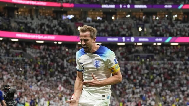 England's Harry Kane celebrates scoring his side's second goal during the World Cup round of 16 soccer match between England and Senegal, at the Al Bayt Stadium in Al Khor, Qatar, Sunday, Dec. 4, 2022. (AP Photo/Frank Augstein)