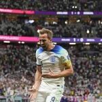 England's Harry Kane celebrates scoring his side's second goal during the World Cup round of 16 soccer match between England and Senegal, at the Al Bayt Stadium in Al Khor, Qatar, Sunday, Dec. 4, 2022. (AP Photo/Frank Augstein)