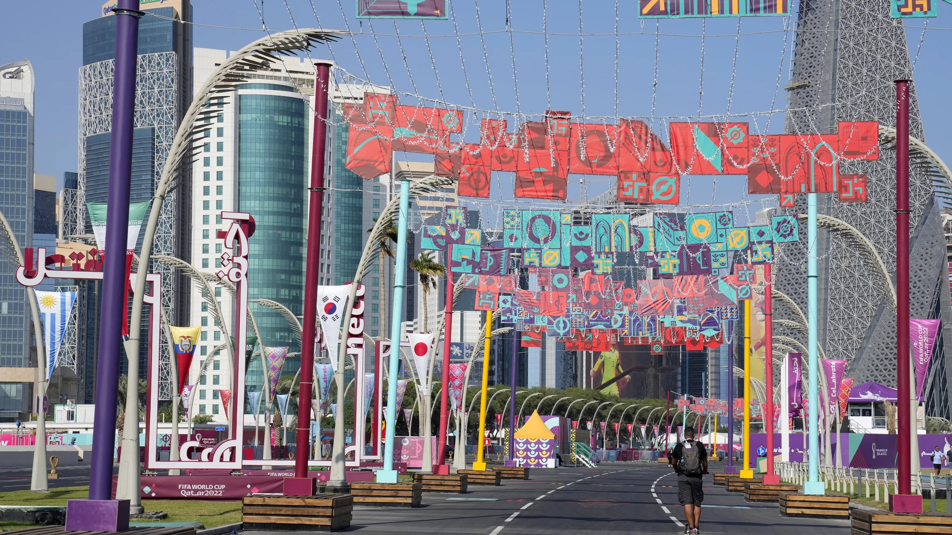 A man rides along the decorated Doha Corniche in Doha, Qatar, Saturday, Dec. 3, 2022. (AP Photo/Aijaz Rahi)