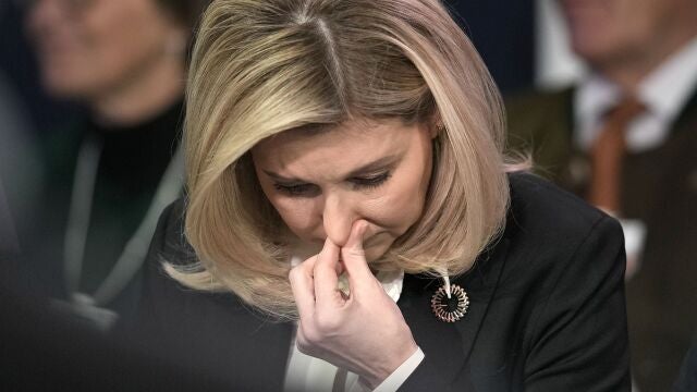 First Lady of Ukraine Olena Zelenska reacts at the World Economic Forum in Davos, Switzerland after the news of a helicopter crash in Ukraine, where Minister of Internal Affairs Denys Monastyrsky died among others on Wednesday, Jan. 18, 2023. The annual meeting of the World Economic Forum is taking place in Davos from Jan. 16 until Jan. 20, 2023. (AP Photo/Markus Schreiber)