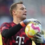 Bayern's goalkeeper Manuel Neuer holds the ball prior to the German Bundesliga soccer match between Hertha BSC Berlin and FC Bayern Munich in Berlin, Germany,