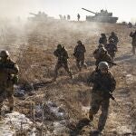 Ukrainian servicemen of the 3rd Separate Tank Iron Brigde take part in an exercise in the Kharkiv area, Ukraine, Thursday, Feb. 23, 2023, the day before the one year mark since the war began. War has been a catastrophe for Ukraine and a crisis for the globe and the world is a more unstable and fearful place since Russia invaded its neighbor on Feb. 24, 2022