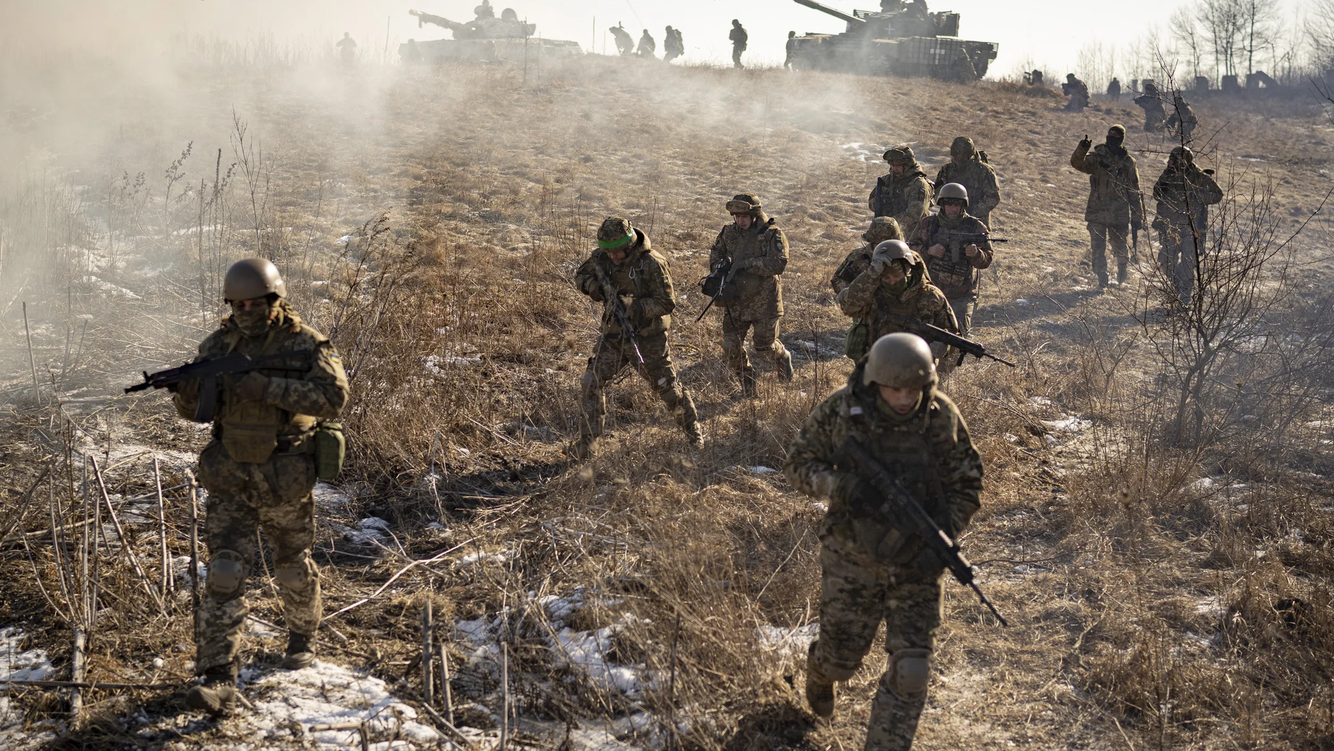 Ukrainian servicemen of the 3rd Separate Tank Iron Brigde take part in an exercise in the Kharkiv area, Ukraine, Thursday, Feb. 23, 2023, the day before the one year mark since the war began. War has been a catastrophe for Ukraine and a crisis for the globe and the world is a more unstable and fearful place since Russia invaded its neighbor on Feb. 24, 2022