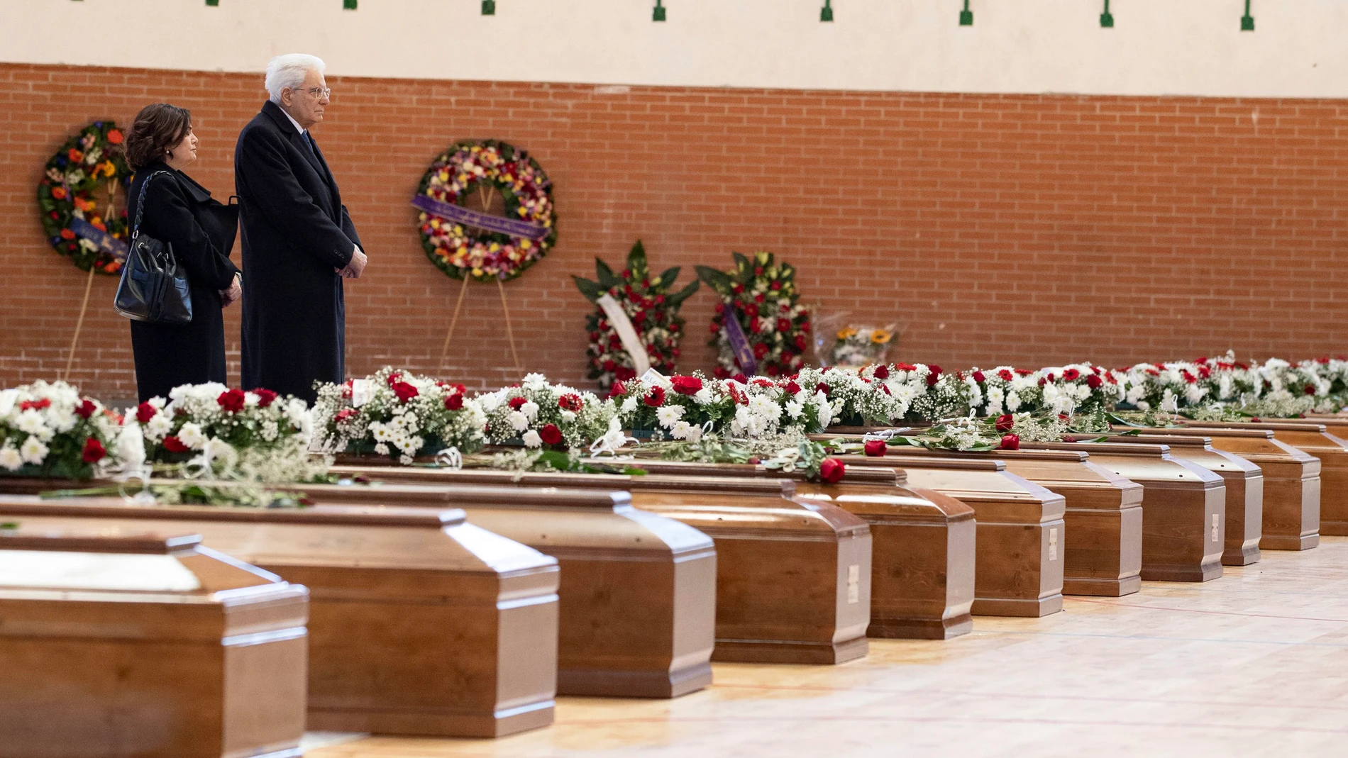 Crotone (Italy), 02/03/2023.- A handout photo made available by the Quirinal Press Office shows Italian President Sergio Mattarella paying homage to the victims who died in a migrant shipwreck, at the Crotone Palasport, the funeral home for the victims, in Crotone, Italy, 02 March 2023. At least 67 migrants died after their overloaded boat sank early on 26 February 2023 in stormy seas off Italy's southern Calabria region. (Italia) EFE/EPA/FRANCESCO AMMENDOLA / QUIRINAL PRESS OFFICE / HANDOUT HANDOUT EDITORIAL USE ONLY/NO SALES