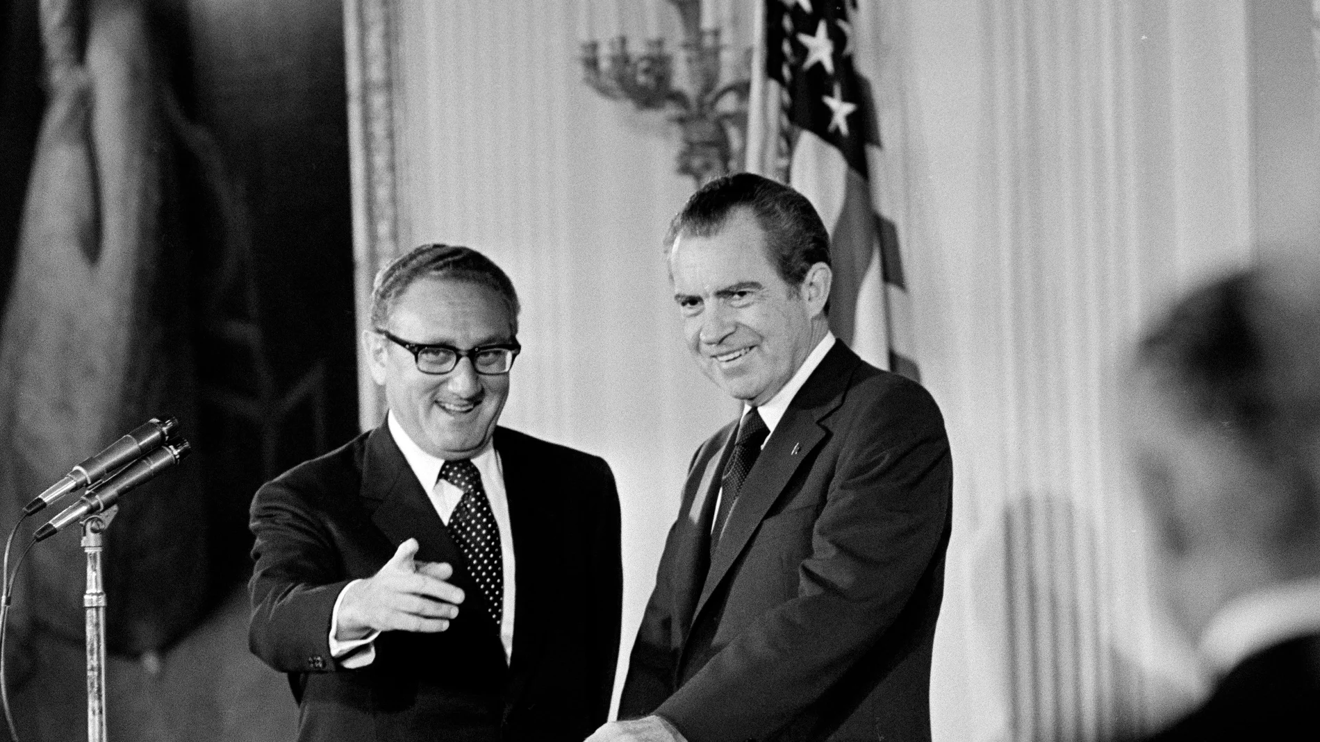 U.S. Secretary of State Henry Kissinger, left, and President Richard M. Nixon are shown after Kissinger was sworn is as the 56th secretary of state in the East Room of the White House in Washington, D.C., in this Sept. 22, 1973, file photo.