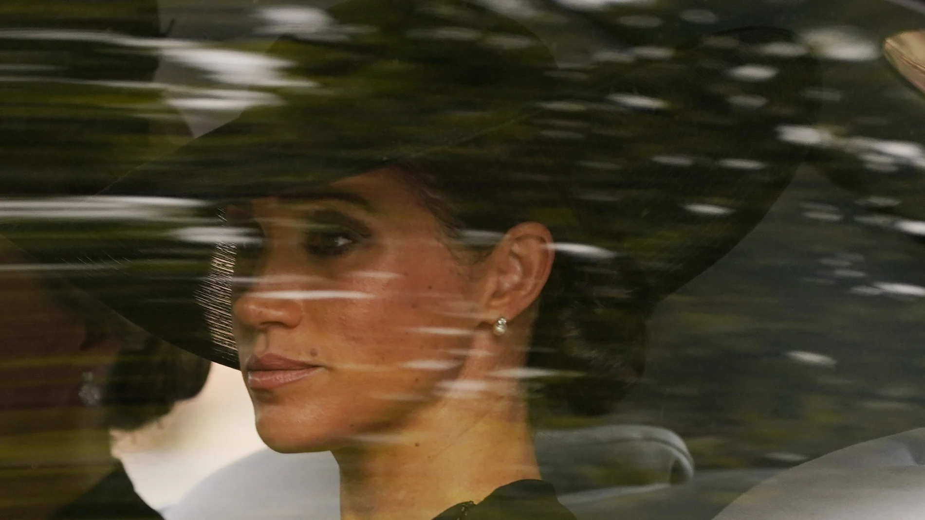Meghan, the Duchess of Sussex, is driven following the coffin of Queen Elizabeth II carried after her funeral service in Westminster Abbey, in central London Monday Sept. 19, 2022