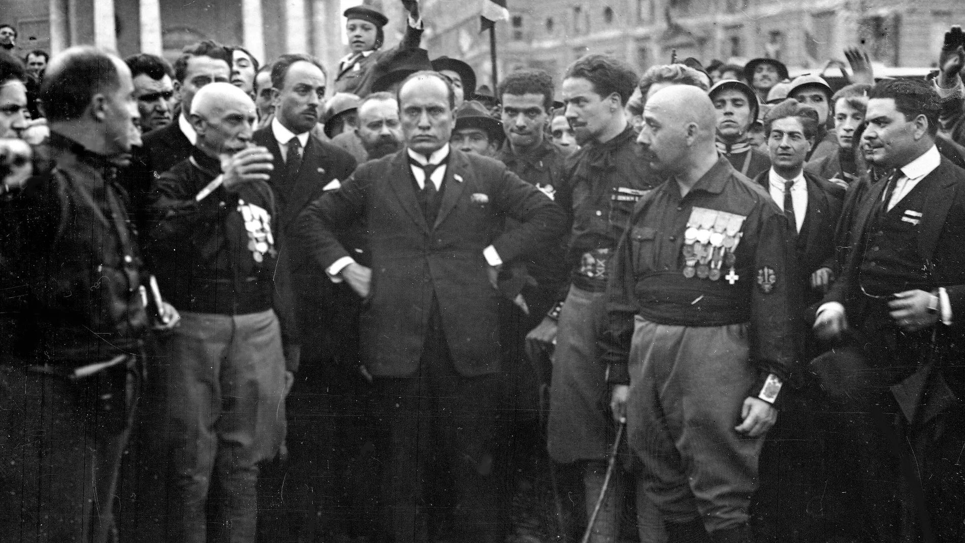 Italian Fascist leader Benito Mussolini, center, hands on hips, with members of the Fascist Party, in Rome, Italy, Oct. 28, 1922, following their March on Rome.