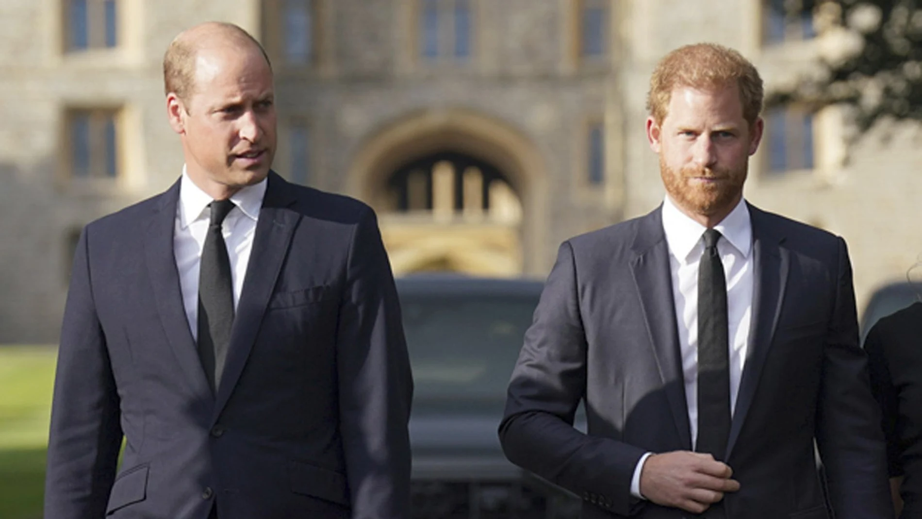 Britain's Prince William, Prince of Wales, left and Prince Harry walk to meet members of the public at Windsor Castle, following the death of Queen Elizabeth II