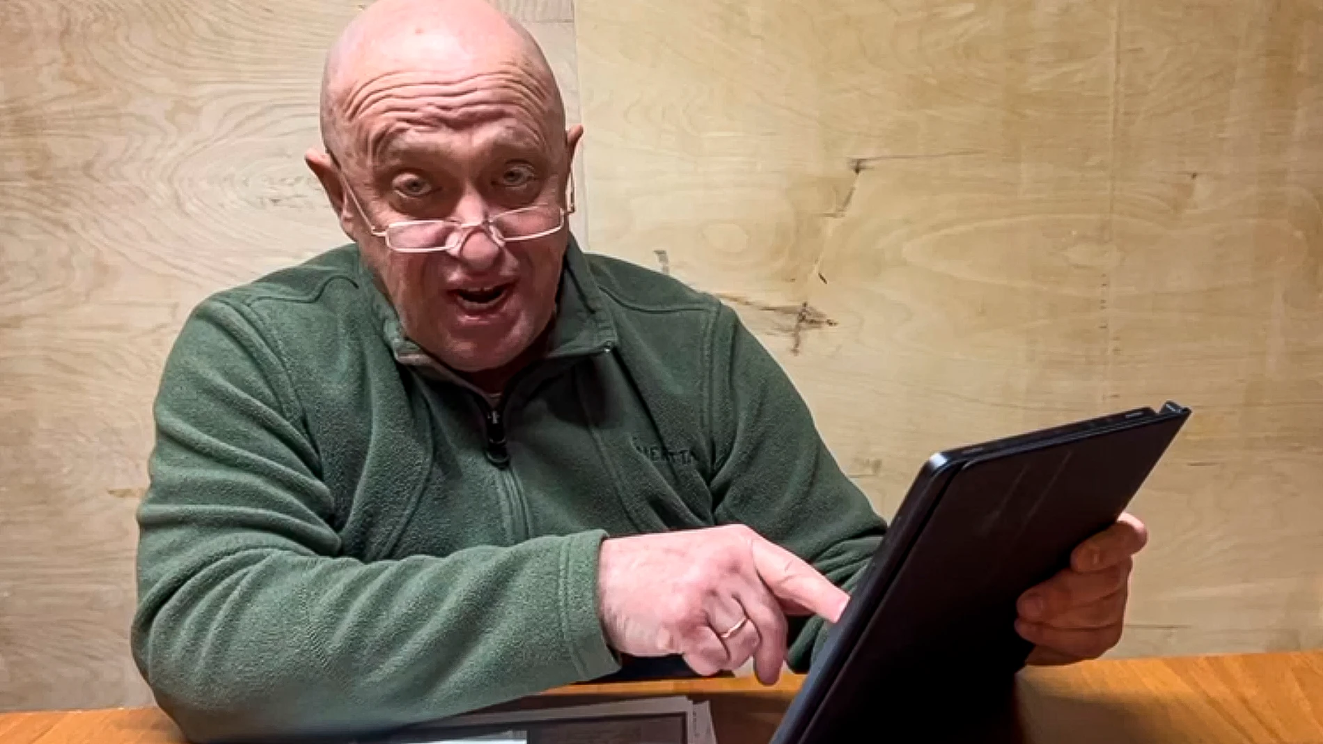 In this handout image taken from a video released by Prigozhin Press Service on Friday, May 12, 2023, head of Wagner Group Yevgeny Prigozhin makes a video statement from an unknown location. In a video statement Friday, Prigozhin mocked the Russian Defense Ministry's report claiming that its forces regrouped to take more favorable positions, saying they effectively fled and "our flanks are crumbling." (Prigozhin Press Service via AP)