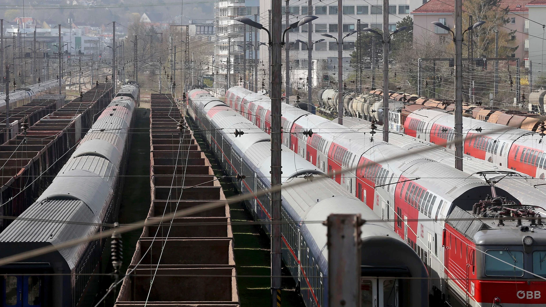 FILE - Trains are parked at a station in Vienna, Austria, Friday, March 27, 2020. Two people were charged in Austria for allegedly playing speeches by Adolf Hitler via the loudspeaker system of a train running from Bregenz to Vienna, Austrian news agency APA reported Monday, May 15, 2023. (AP Photo/Ronald Zak, File)
