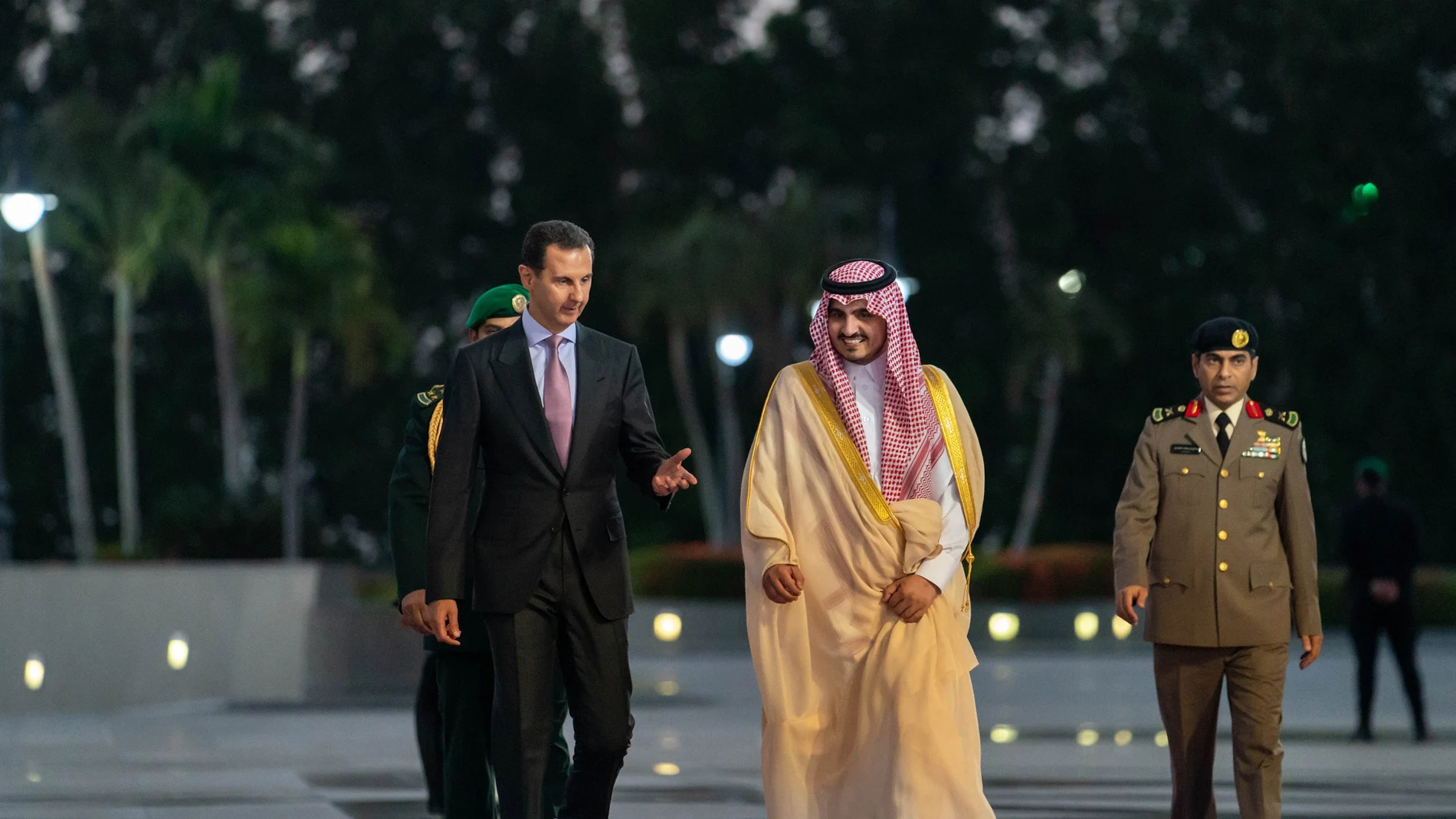 HANDOUT - 18 May 2023, Saudi Arabia, Jeddah: Syrian President Bashar Al-Assad (L) is received by Mecca Province Deputy Governor Prince Badr bin Sultan bin Abdulaziz Al Saud, as he arrives in Jeddah to attend the 32nd Arab Summit.