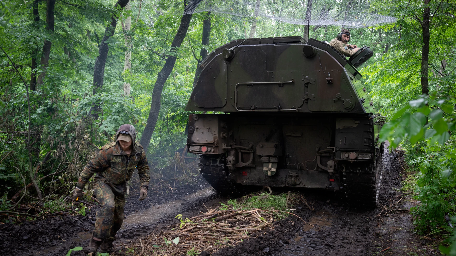 A Ukrainian army, German self-propelled Panzerhaubitze 2000, artillery drives to its position at the frontline near Bakhmut, Donetsk region, Ukraine, Saturday, May 27, 2023. (AP Photo/Efrem Lukatsky)