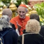 New cardinal Matteo Maria Zuppi (C) attends Pope Francis' opening Mass for the Amazon synod, in St. Peter's Basilica, at the Vatican, Sunday, Oct. 6, 2019. 