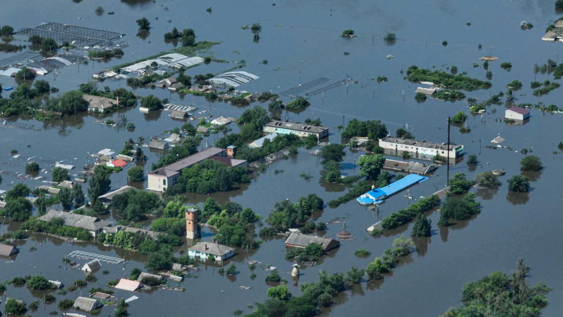CAPTION CORRECTS LOCATION - Houses are seen underwater in the flooded village of Dnipryany, in Russian-occupied Ukraine, Wednesday, June 7, 2023, after the collapse of Kakhovka Dam. (AP Photo)
