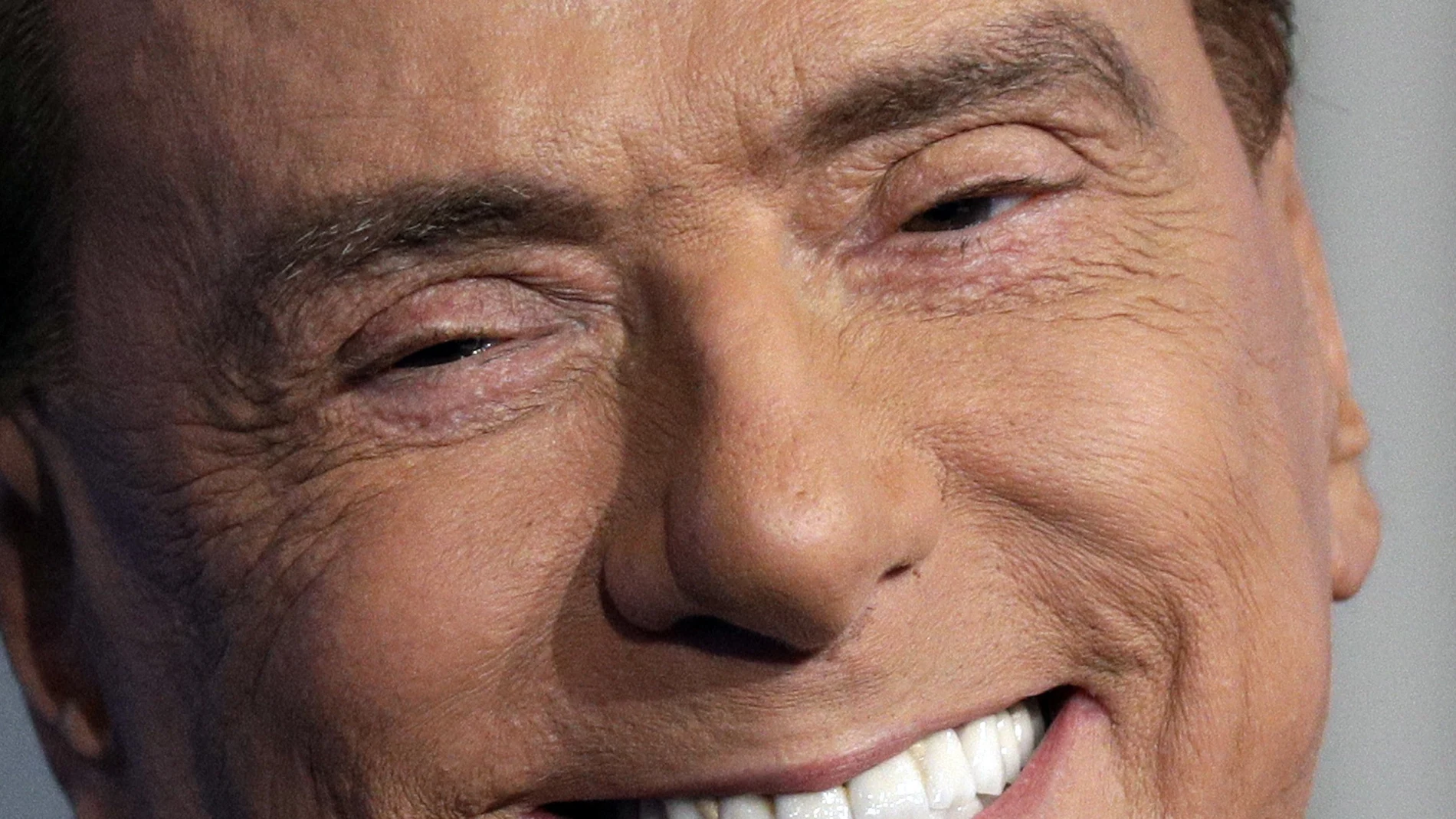 Italian former Premier and Forza Italia (Go Italy) party leader, Silvio Berlusconi, smiles during the recording of the Italian state television RAI, Porta a Porta