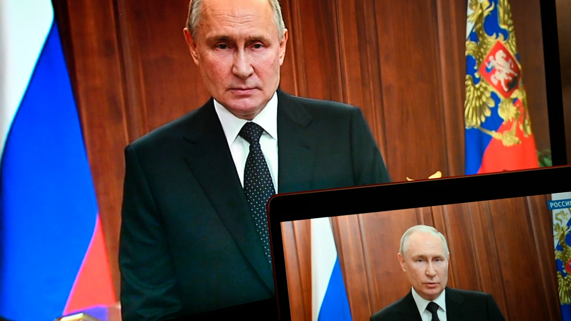 FILE - Russian President Vladimir Putin is seen on monitors as he addresses the nation after Yevgeny Prigozhin, the owner of the Wagner Group military company, called for armed rebellion and reached the southern city of Rostov-on-Don with his troops, in Moscow, Russia, Saturday, June 24, 2023. A weekend revolt by Russian mercenary forces have undermined Putin's power, setting the stage for further challenges to his rule at home and possibly weakening Russia’s hand in the war in Ukraine. (Pave...
