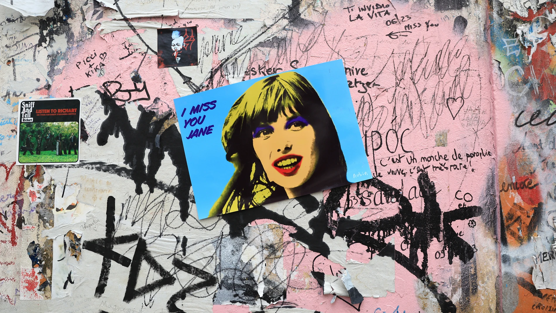 A sticker shows singer and actress Jane Birkin at the house where she and French singer Serge Gainsbourg used to live, Monday, July 17, 2023 in Paris. Jane Birkin, who made France her home and charmed the country with her English grace, natural style and social activism, has died Sunday July 16, 2023 at age 76. The London-born star and fashion icon was known for her musical and romantic relationship with French singer Serge Gainsbourg. (AP Photo/Aurelien Morissard)