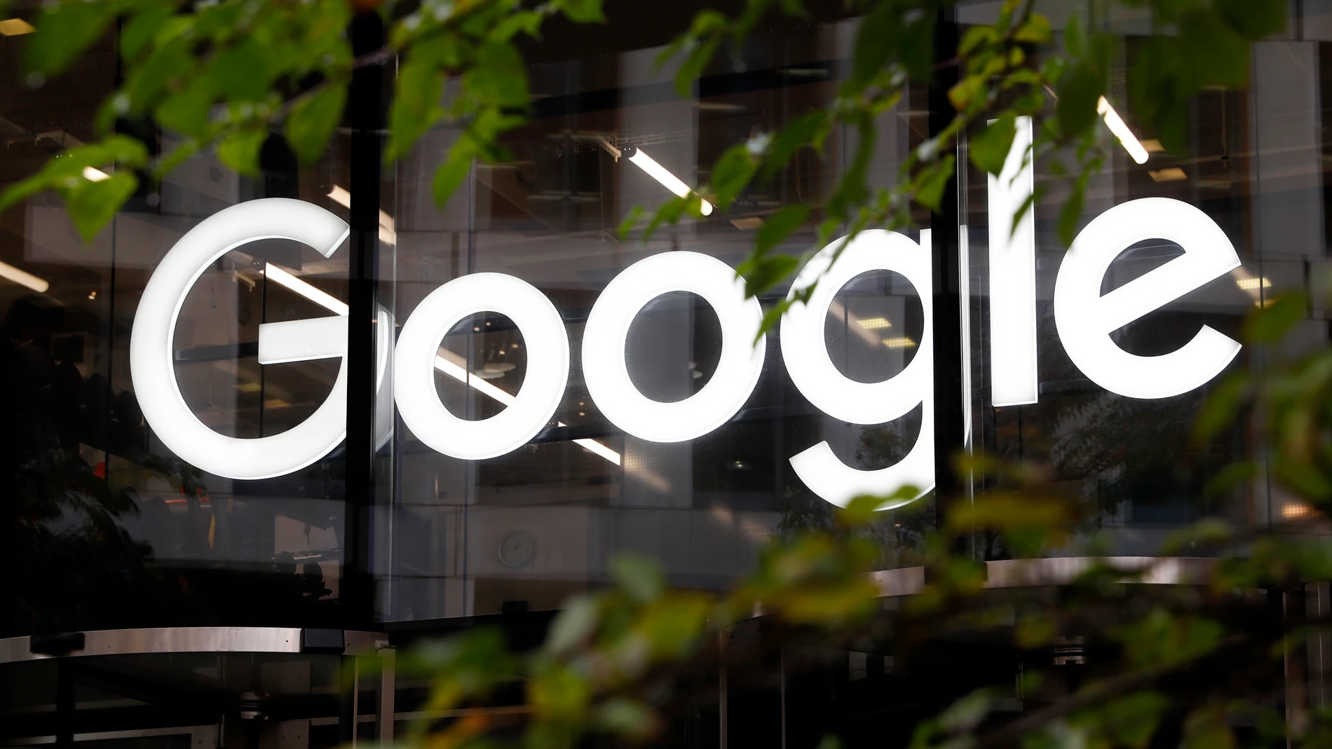 FILE - The Google logo is displayed at their offices, Nov. 1, 2018, in London. Google says, Thursday, July 20, 2023, it is in the early stages of developing artificial intelligence tools to help journalists write stories and headlines, and has discussed its ideas with leaders in the news industry. (AP Photo/Alastair Grant, File)