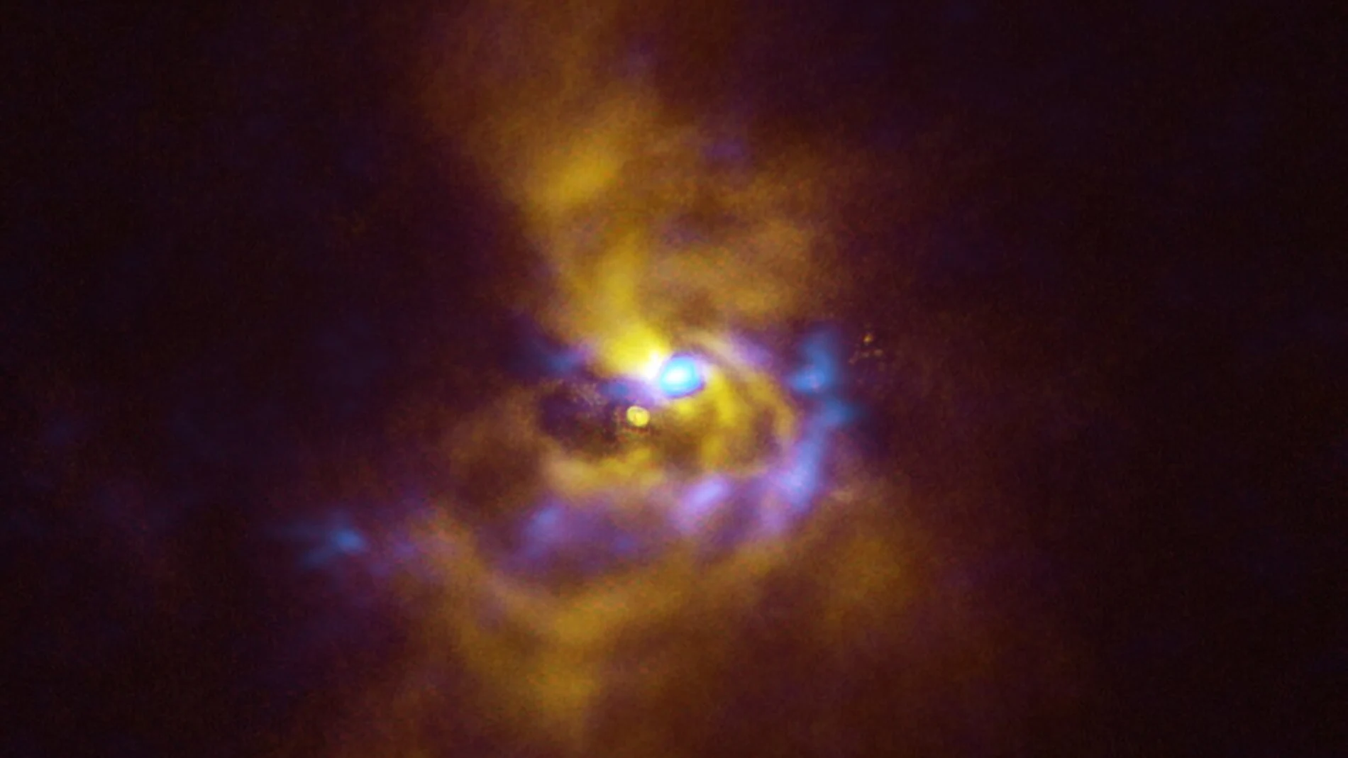 En el centro de esta imagen se encuentra la joven estrella V960 Mon situada a más de 5000 años luz en la constelación de monoceros. Material polvoriento con potencial para formar planetas rodea a la estrella. Observaciones obtenidas con el sistema de investigación de exoplanetas de alto contraste espectropolarimétrico