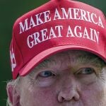 Former President Donald Trump greets golfers and supporters on the driving range before the start of the final round of the Bedminster Invitational LIV Golf tournament in Bedminster