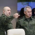 General Sergei Surovikin (L), commander of Russia's military operation in Ukraine, and Russian Defence Minister Sergei Shoigu (C) during a visit by Russian President Putin to the joint headquarters of the military branches of the Russian armed forces involved in the 'special military operation' in Ukraine, at an undisclosed location in Russia.