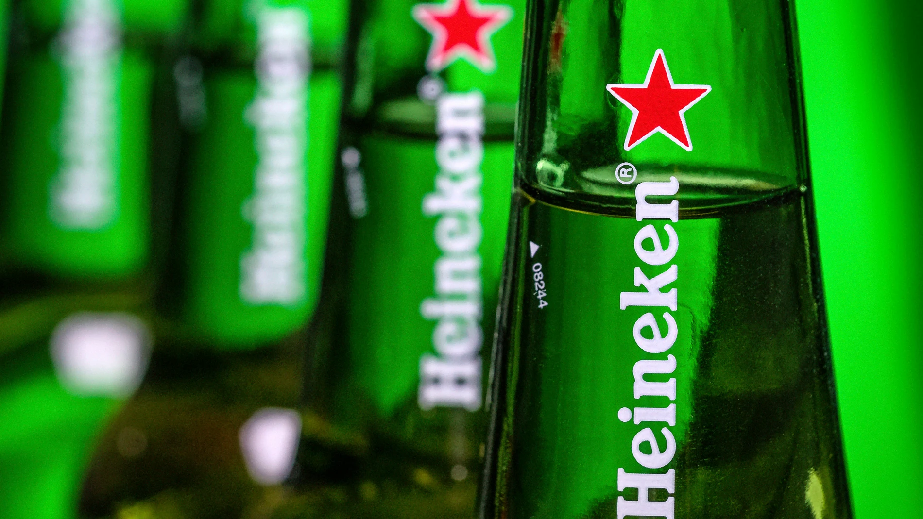 FILE - Bottles of Heineken beer are photographed in Washington, USA, March 30, 2018. Dutch brewer Heineken has completed its withdrawal from Russia, 18 months after Moscow launched its full-scale invasion of Ukraine, selling its business in Russia for just 1 euro, the company announced Friday, Aug. 25, 2023. (AP Photo/J. David Ake, FILE)
