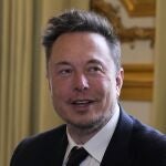 Elon Musk poses prior to his talks with French President Emmanuel Macron